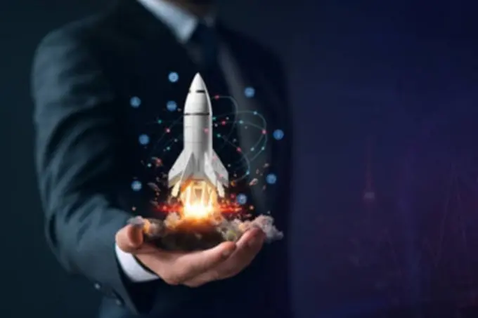 Rocket launching from an open hand above performance data, illustrating optimisation after launch