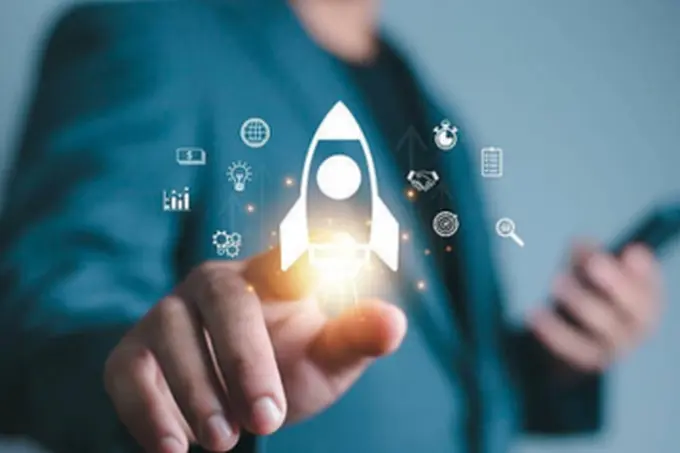 Hand choosing a rocket icon among strategy icons, illustrating digital project planning and strategy
